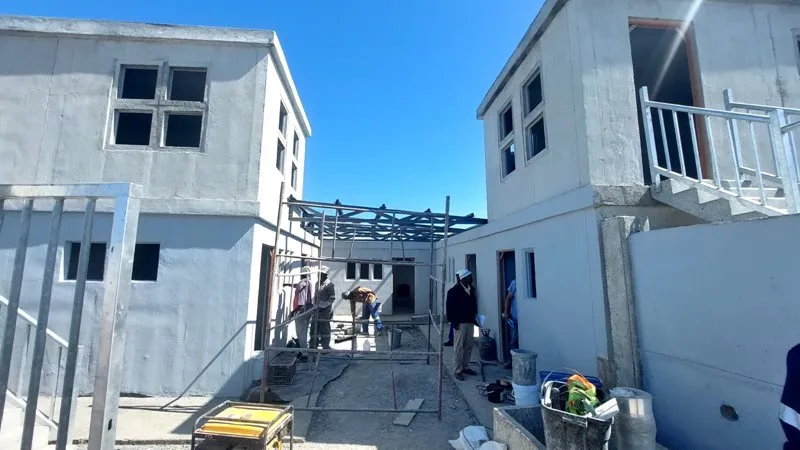 Community volunteer supporting learners at a local school
