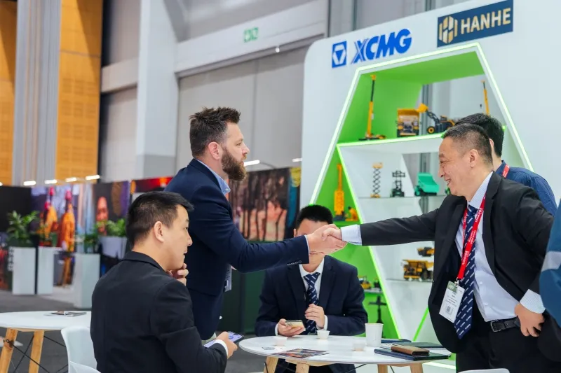 Business meeting at an equipment supplier stand