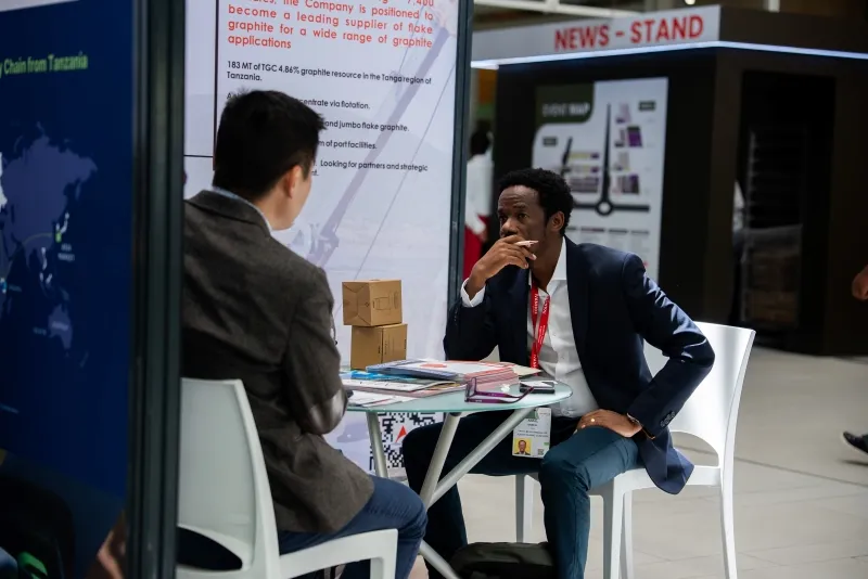 Mining professionals networking during a business meeting at Mining Indaba
