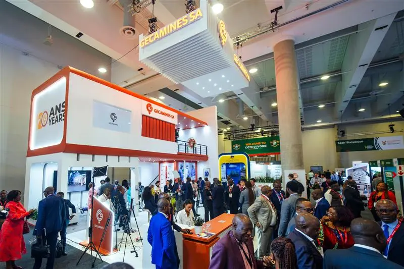 Exhibitors and attendees networking across the Mining Indaba exhibition hall